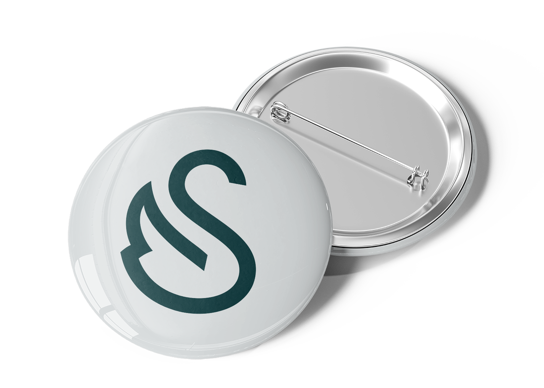 Mockup of Swansboro West logo on a button pin