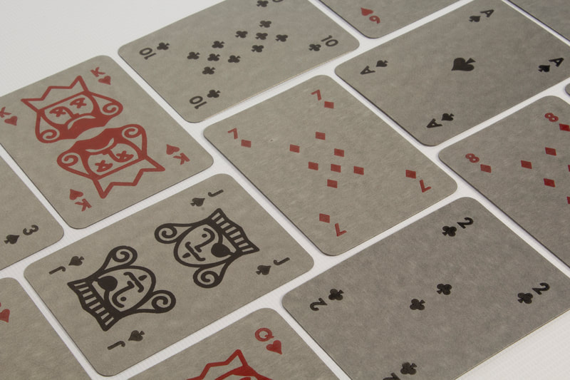 Photo of handmade playing cards spread on a table