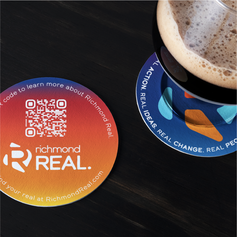 Richmond Real branded coasters on a table